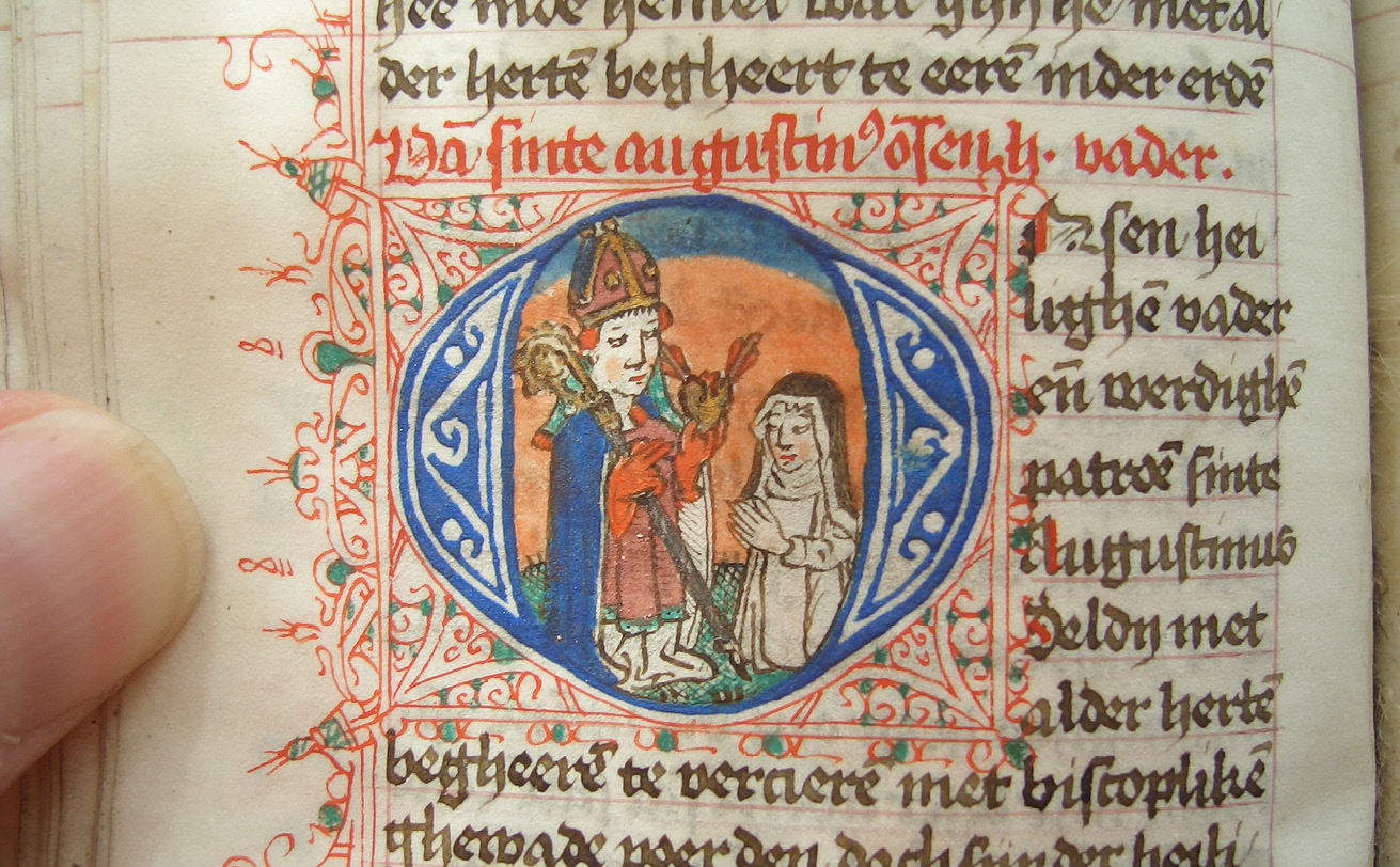 Fig.  125  Folio in a prayerbook, with prayers to ‘our holy father’ St Augustine, with an Augustinian sister kneeling before him. Heverlee, Abdij van Park, Ms. 18, fol. 79v.