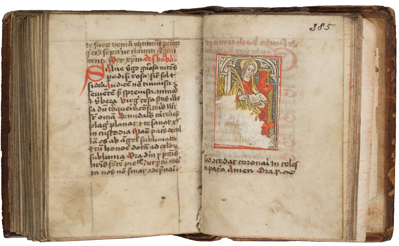 Fig. 134  Opening in a prayerbook with the remains of added woodcut depicting St Barbara. Cambridge, Gonville and Caius College, Ms. 718/253, fol. 384v-385r.