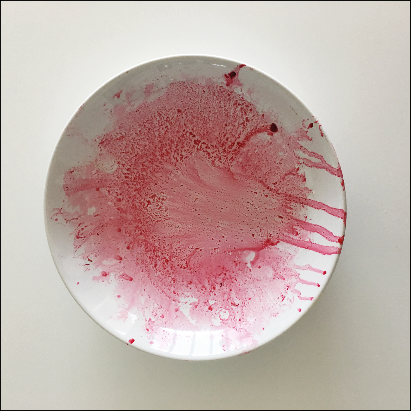 The traces of something dark pink in a white bowl - possibly beetroot, now all gone