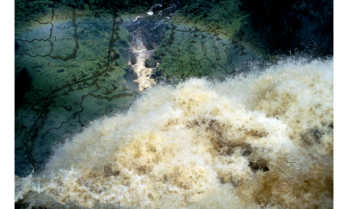 A staged colour photograph of Kaiteur waterfall in Guyana and a colonial map superimposed over the green wooded area of the landscape. This is a view from above looking over the waterfall which cascades over precipice. The cascading water over the precipice occupies the bottom right of the photograph, with the river it runs into flowing away in the central part of the photograph with a rainbow arc featured across the top left. The colonial map is superimposed and layered over the dense green wooded area occupying the rest of the photograph. 