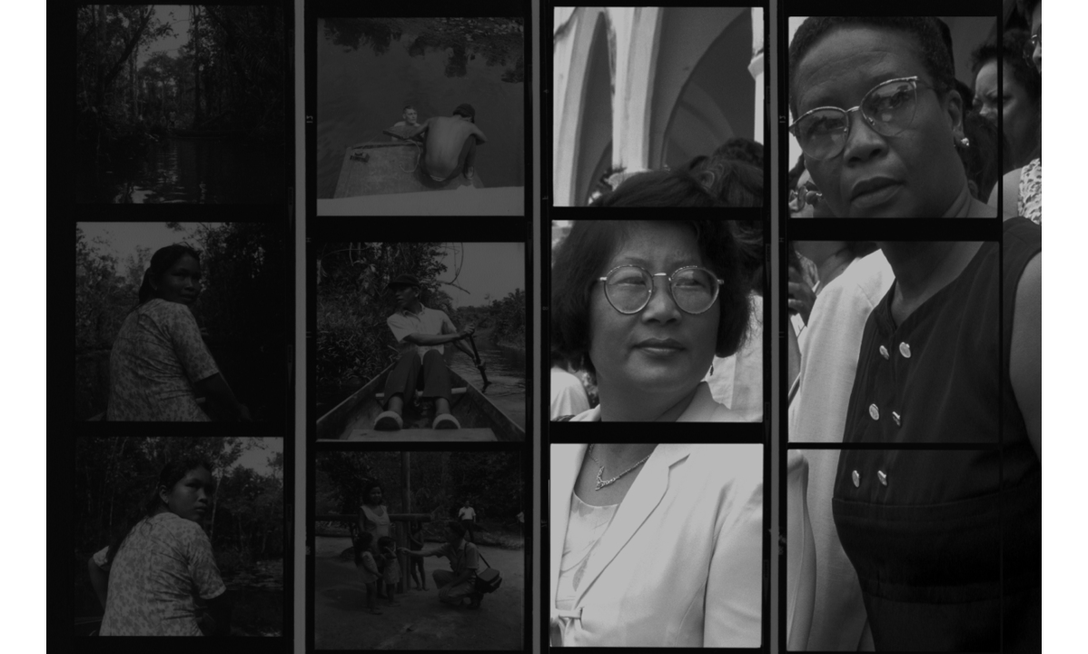 A staged black and white photograph as an enlarged contact sheet of photographs that are square in format.  There are four strips of contact sheets across the photograph each with three photographs appearing vertically. Half of the contact sheet the first six photographs of the contact sheet on the left hand side, have been slightly darkened. These photographs are of Guyanese persons from the first nations involving a canoe journey, and a few women and men in the river, swimming, paddling, on a jetty and in the village. It includes a white european man with the villagers and on the canoe. The original contact sheet is from Fr. Darke's archive, georgetown, Guyana. The right-hand-side of the photograph is of two women who are looking out to the right of the photograph. They have been superimposed into the contact sheet.