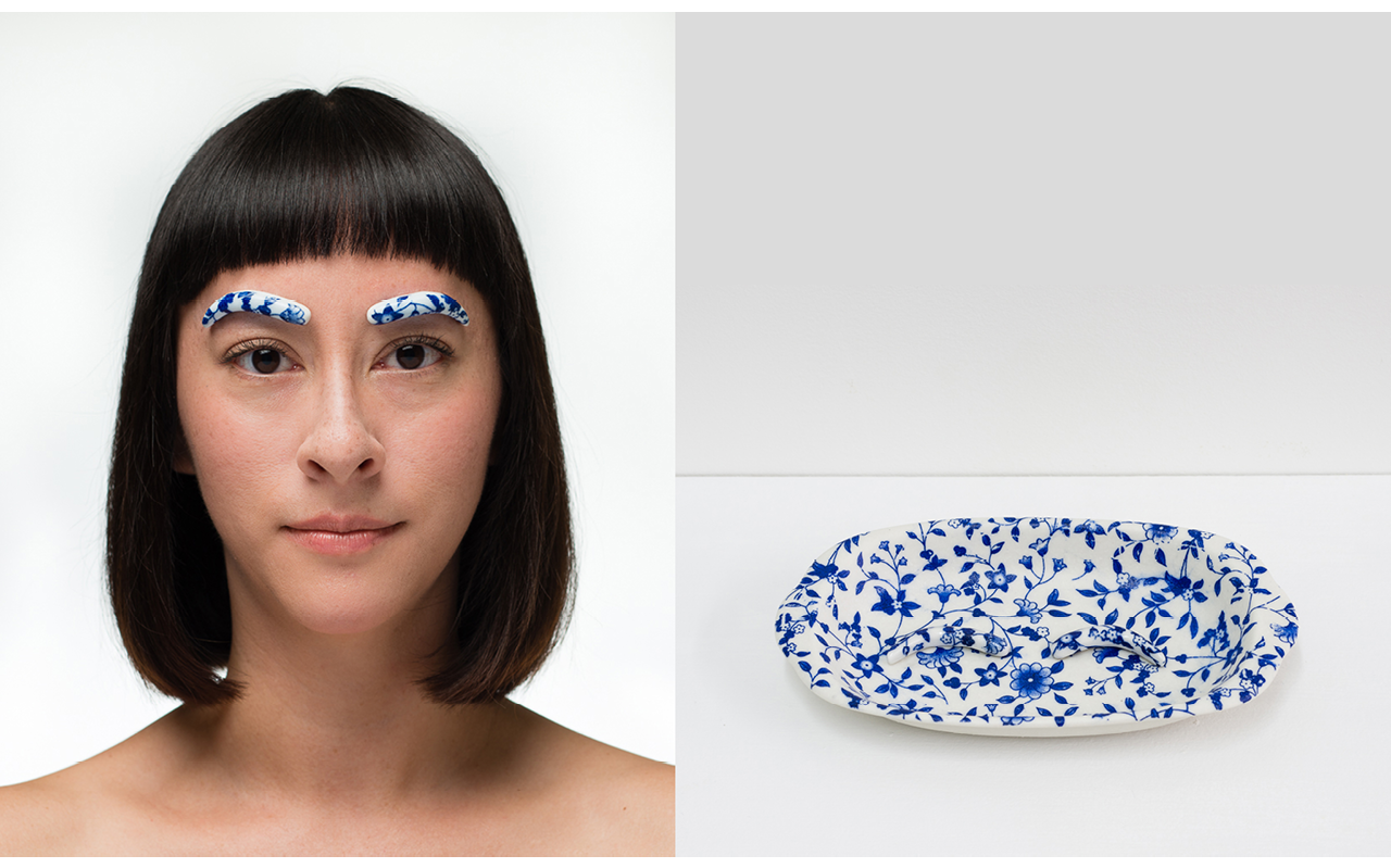 Two images. The left image is a portrait of a woman with a bob and straight cut bangs. Her eye brows are white with blue floral pattern. The background is white. The right image is of a white plate with a blue flora pattern. The plate is sitting on a white table. The background is white.