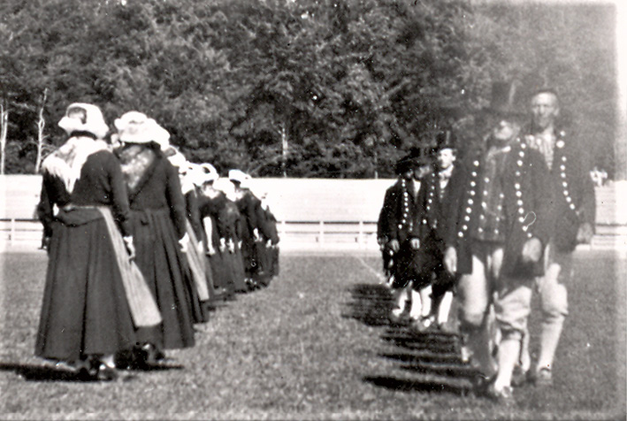 A group of Danish folk dancers dance a minuet from Randers at a Nordic folk dance convention in Aarhus (1946). Photograph.