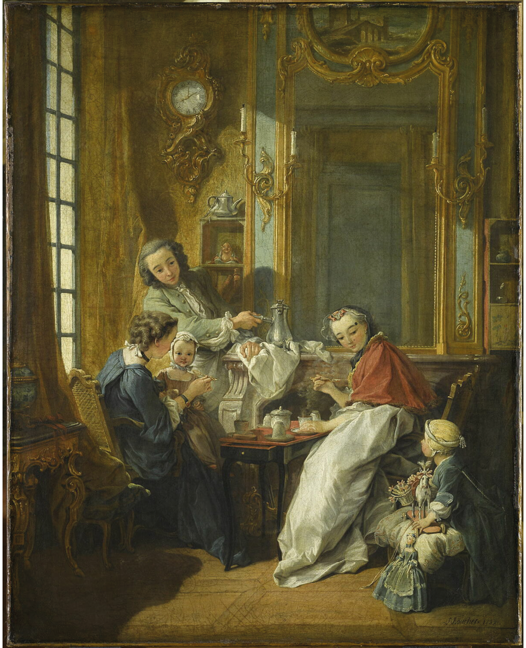 An oil painting from 1739; depicts a high-class French family having breakfast; the family sits around a table with food; it includes a man holding a pot as he looks at the young girl sitting in the floor holding her toys while looking back at him, an older woman spoon-feeding a young girl, and a younger woman sitting across the older one holding a spoon while looking at the younger girl on the floor; the room itself includes a large gilded mirror, a wall clock, a table with twisted legs, and two shelves with ornate figures.