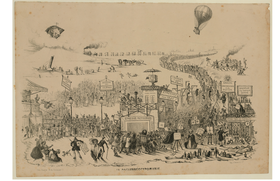 A lithograph print from 1840: shows a large crowd lining up to get photographed; on the top right-hand side, a balloon hovers in the air with a large camera as its basket.