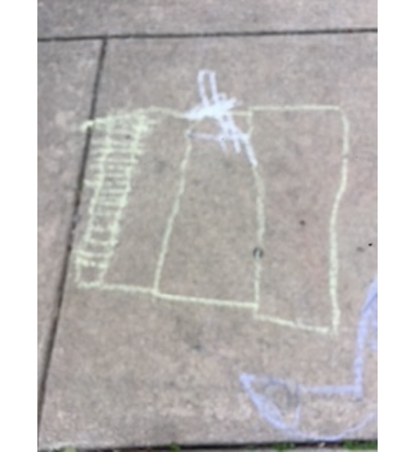 Photo of a tablet held by a child showing their favorite architectural puzzle game