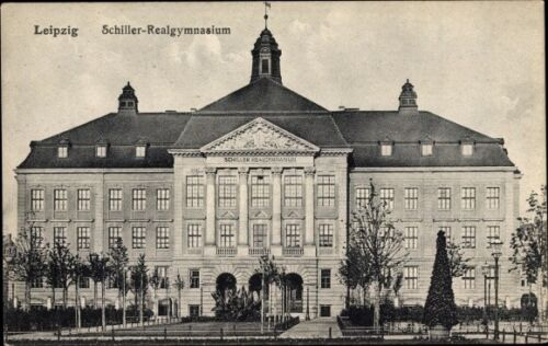A sepia-toned postcard of the Leipzig Schiller-Real-Gymansium with tree-lined paths in front