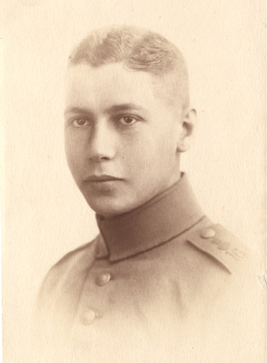 A sepia-toned photograph of a light-haired young man wearing a German army uniform
