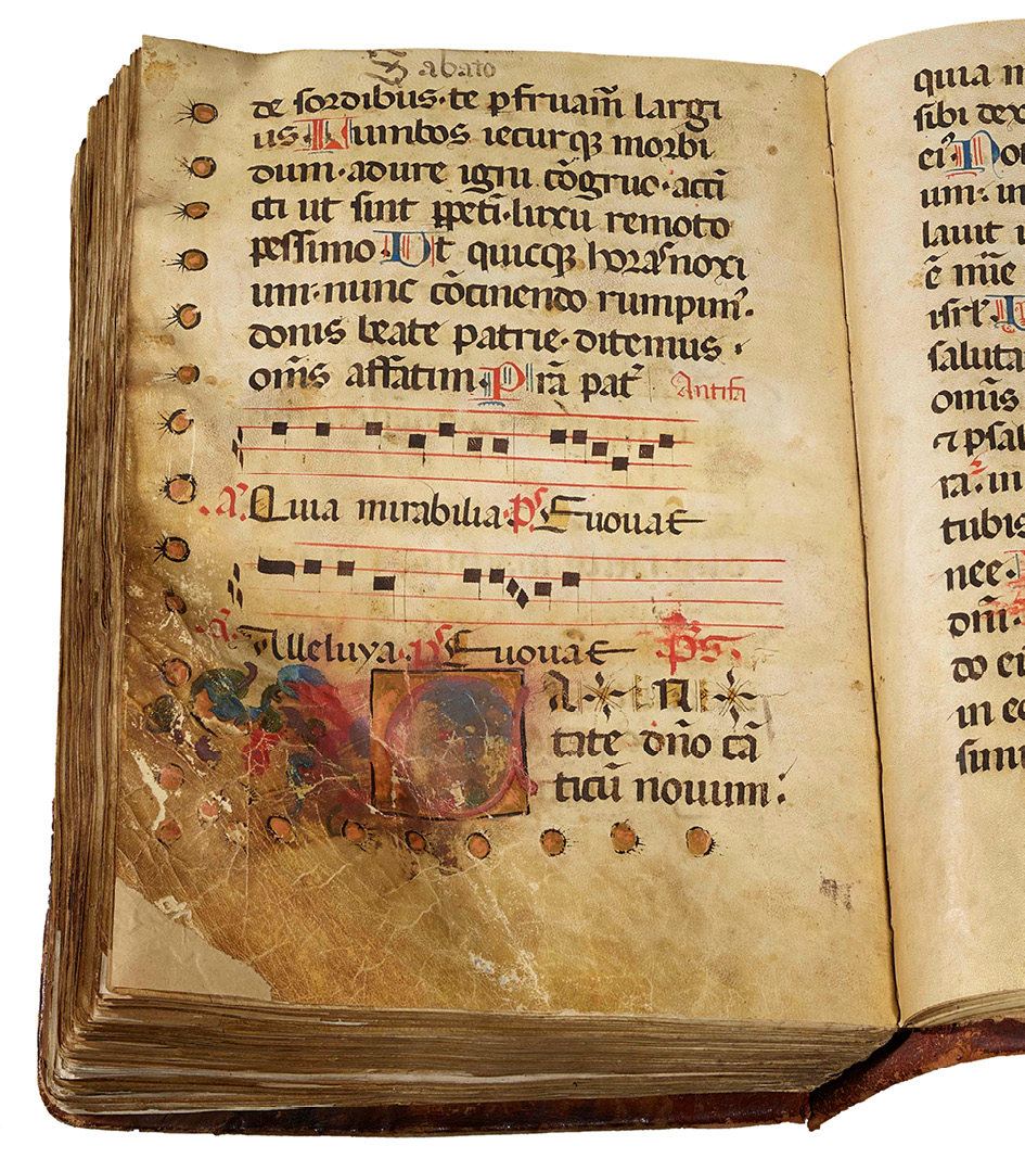 Folio in a noted ferial choir Psalter, possibly for St Lawrence’s, Trau (Dalmatia), made around 1450-1475. This folio has two musical staffs and text in Latin, and a three-line illuminated initial near the lower left corner. The corner of the page has become yellow-brown through handling.