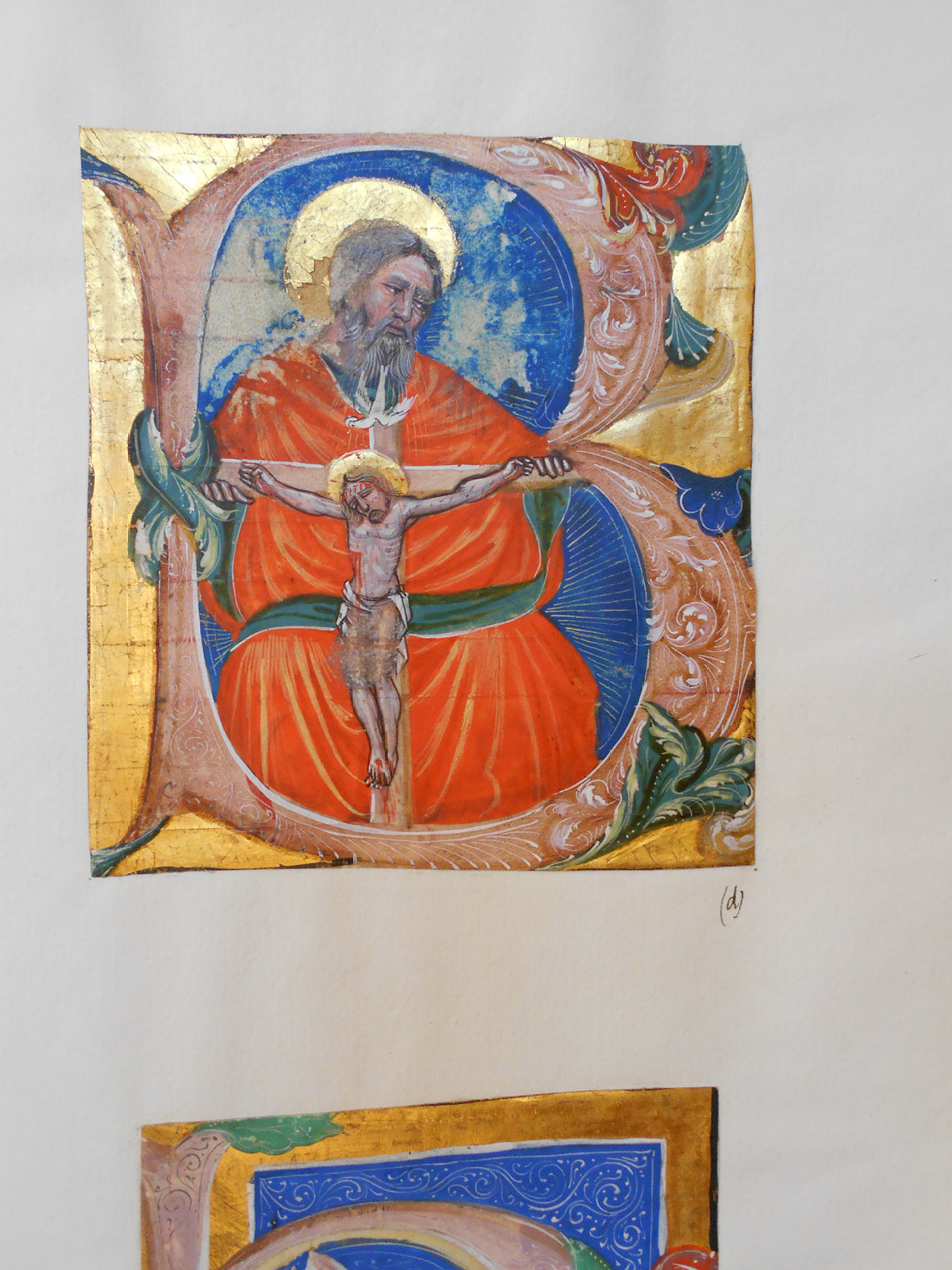 Historiated initial cut from a Venetian antiphonary, mounted at the end of the manuscript. It represents the Trinity within the letter B. The head of God has been touched with a wet finger.