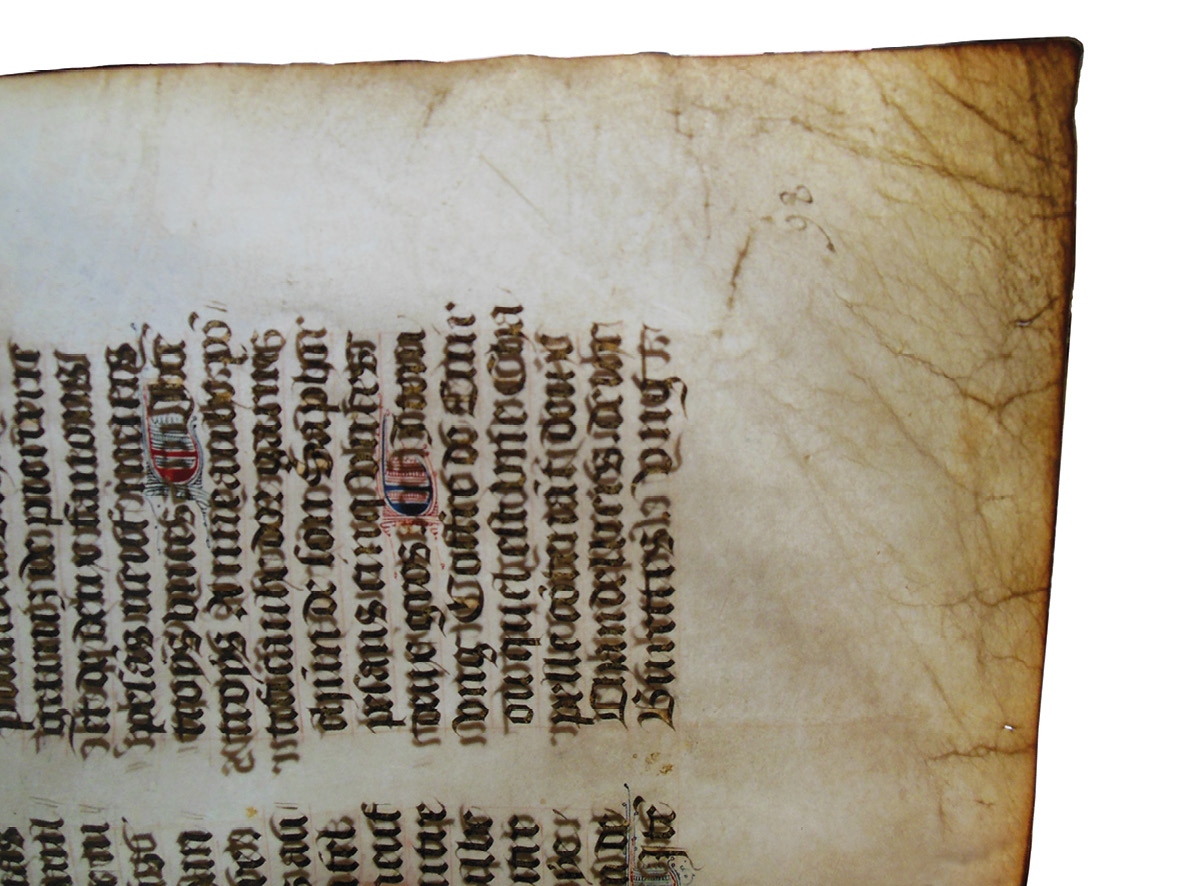Obituary from the original production of the Grand Obituary of Notre-Dame, photographed with backlighting to reveal the extent of the wear, concentrated at the corner.