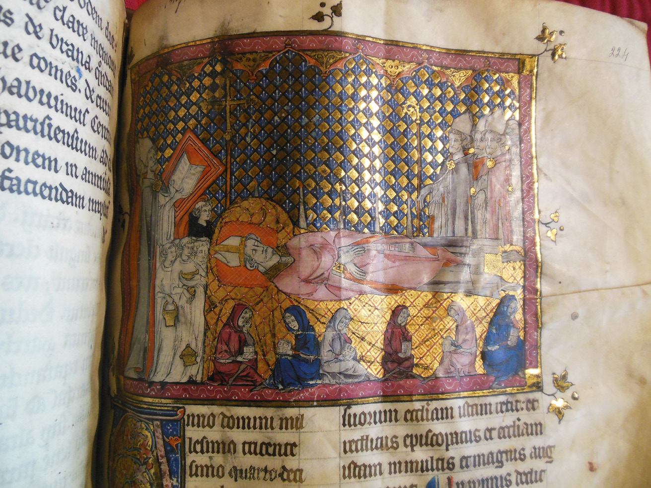 Detail from the the Grand Obituary of Notre-Dame, showing the funeral of Bishop Simon Matifas de Bucy, painted onto an added folio in the. The entry is dated June 22, 1304. The bishop wears a pink gown, and the entire miniautre looks rather fresh.