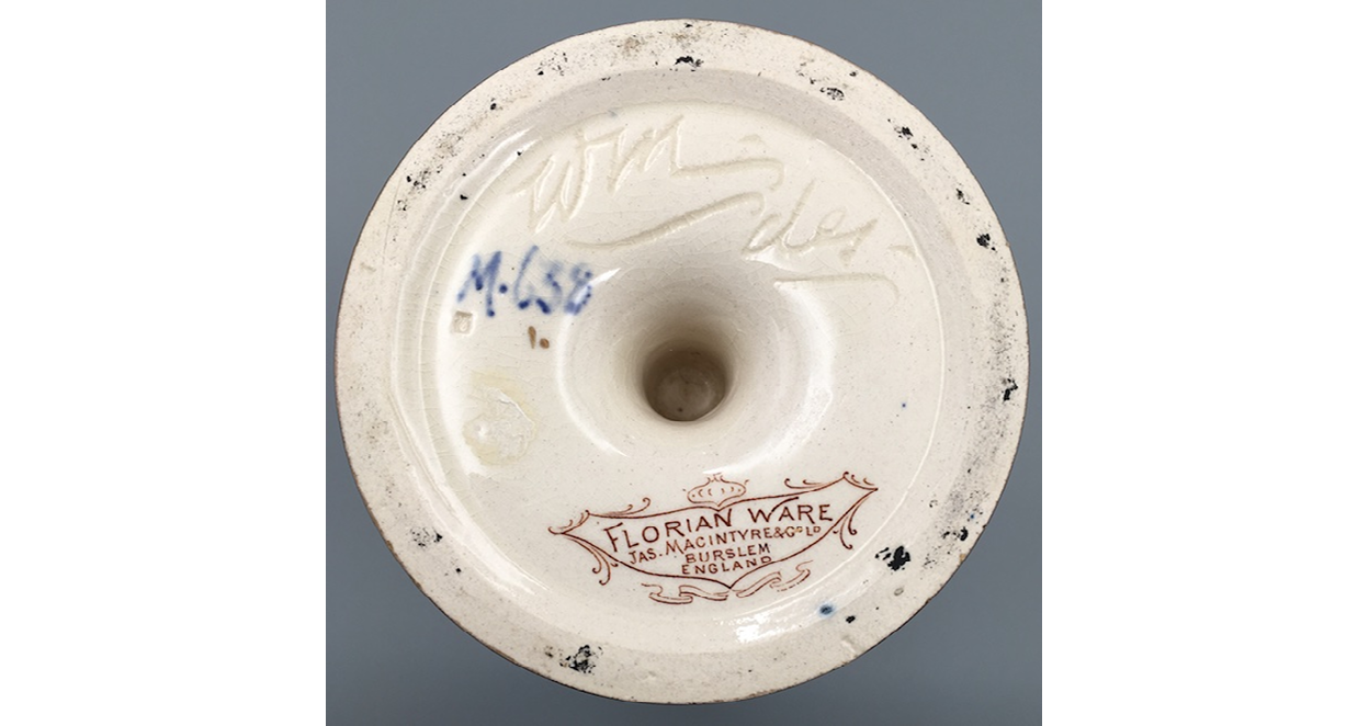 The base shows Moorcroft’s incised initials WM followed by des, the design code M638 handwritten in blue, and an elongated shield-shaped lozenge with the words ‘Florian Ware’, ‘Jas Macintyre & Co. Ltd., Burslem, England’.",,,