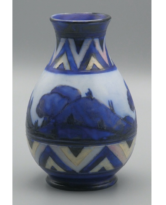 A matt-glaze vase decorated with the Dawn design: a blue hilly landscape with trees stands out against a white ground; it is framed above and below by a band of blue and white chevrons with warm hints of cream and pink.,,,
