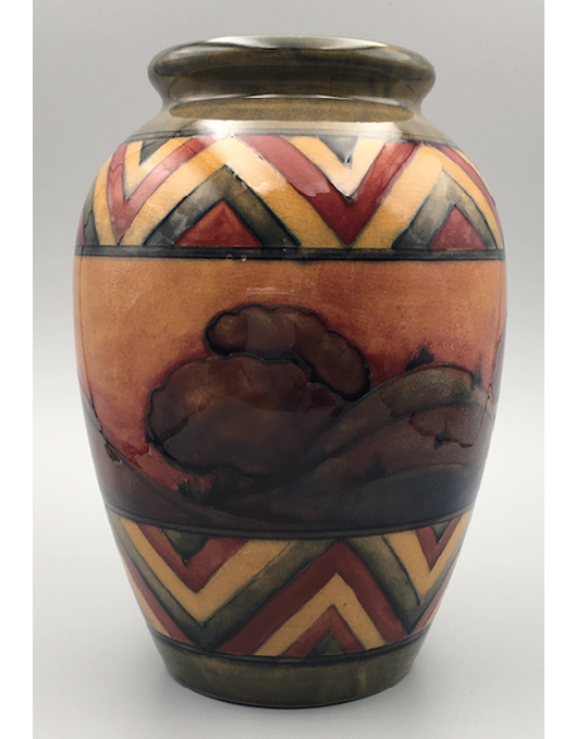 A vase decorated with the Dawn design under a partial flambé glaze, a dark hilly landscape with trees against a fiery sky, framed above and below by a band of chevrons in red, yellow and dark grey,",,,