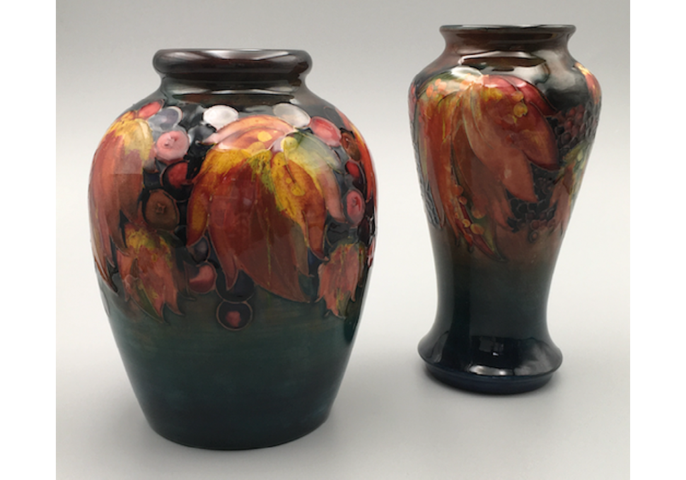 Two flambé vases. The rich and varied colours in the leaf and (black)berries motifs compel attention on their own terms, suggesting designs which are on the border of the abstract and the naturalistic. ",,,