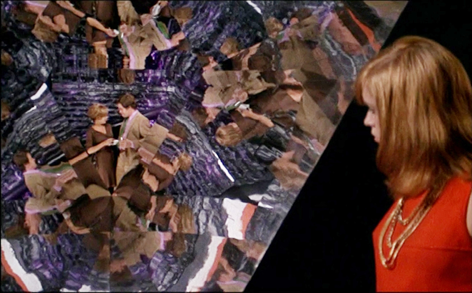 A kaleidoscopic visual from the 1968 film “”La Prisonnière”” by Henri-Georges Clouzot, depicting fragmented and multiplied images of characters in a visually complex, dreamlike scenario. The woman is shown observing this spectacle.”,