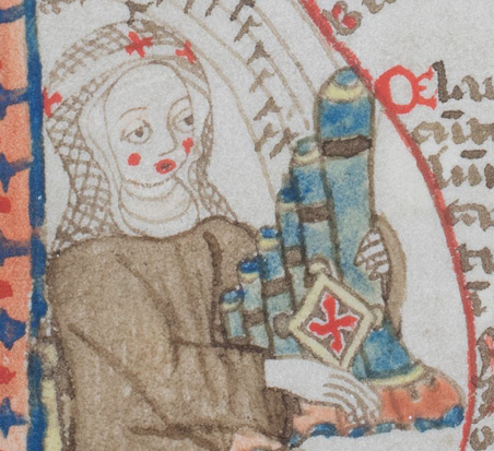 The detail of the miniature from the music textbook shows a nun in a brown habit with a white veil topped by the nun’s crown consisting of white bands with red crosses. The nun’s face is highlighted by two red dots for her cheeks and one for her mouth. With her right hand she plays a small hand organ which she holds with her left. Musical notation is drawn above the pipes of the portatif.