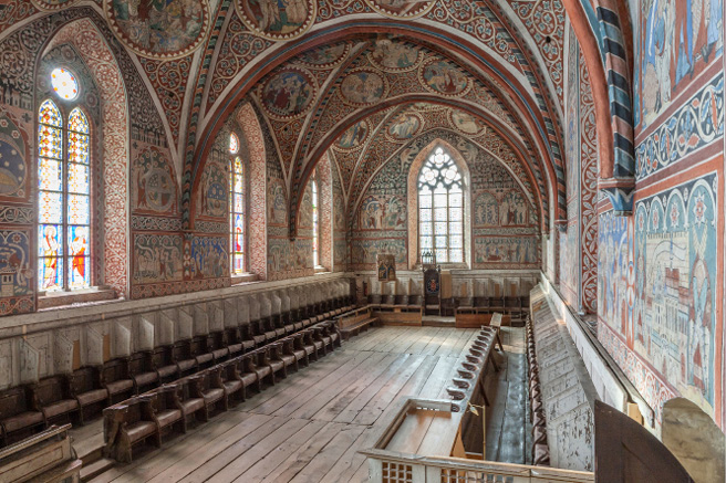The nuns’ choir at Wienhausen as in Fig. 5 but showing the three west bays, seen from the door for exiting the choir at the east end of the north wall. The full length of the choir stalls along the walls are thus visible.
