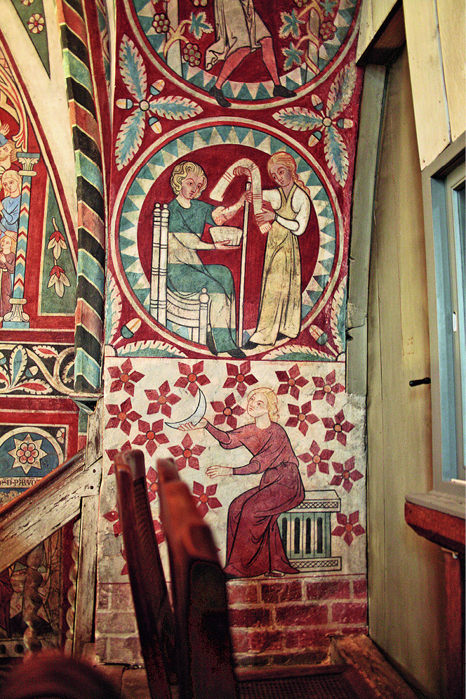 Wall paintings on the arch at the east end of the nuns’ choir at Wienhausen showing different scenes in ornamental frames, among them bloodletting. For a detailed description of the content see the paragraphs above and below the image. To the left of the arch the top of the stairs leading to the raised area behind the altar can be seen; to the right the modern window for looking into the part of the church reserved for the parish.