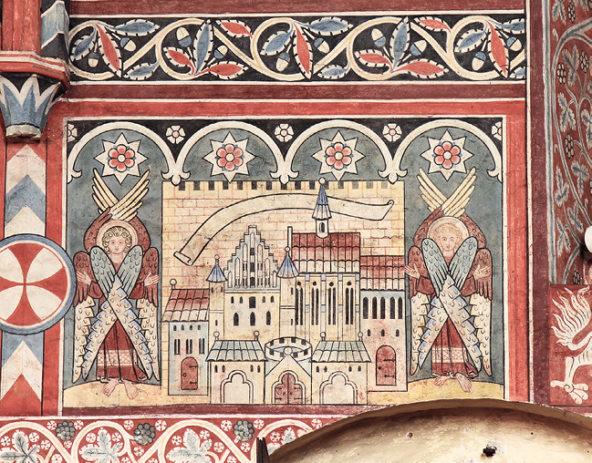 Wall painting above the north-east door of the nuns’ choir at Wienhausen, showing the heavenly Jerusalem as a sequence of buildings, the silhouette of which is very similar to the view of Wienhausen seen from the south (Fig. 37). For a detailed description see the following paragraph. The background is a greyish blue; the buildings now look pale yellow with ochre-coloured doors and roofs.