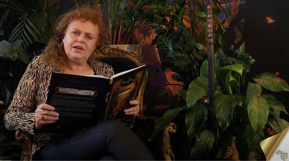 Screenshot of Leontine von Hooft reading from the book ""Fumo Liyongo en de Dans van de Drums"" during the Childrenís book week Week in 2020